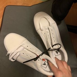All white Old Skool Vans